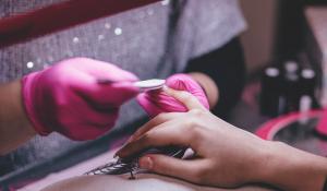 Image: person getting a manicure. Topic: The Search for a Non-Toxic Salon